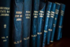 Law books on the shelf (Photo by Rob Girkin on Unsplash)